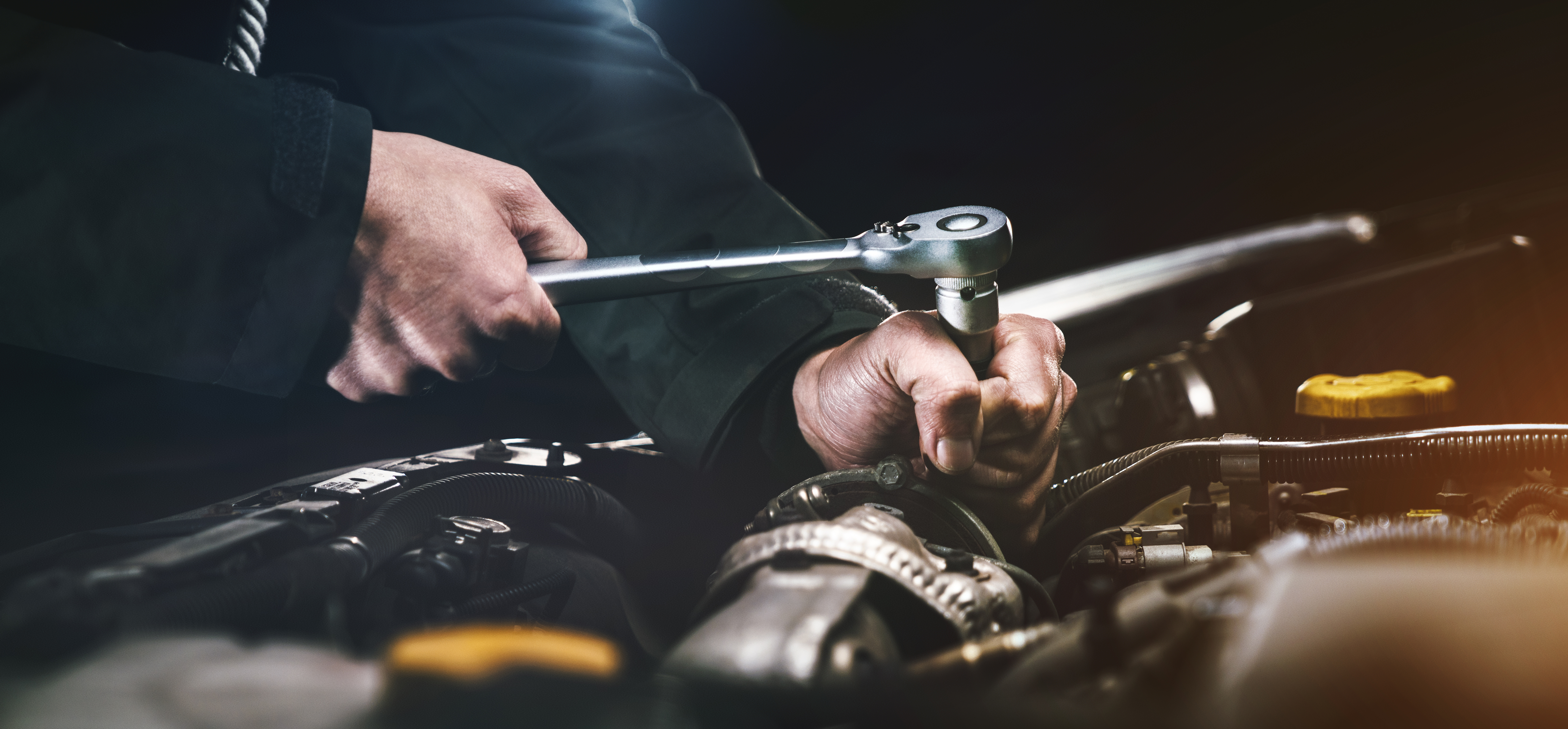 Auto mechanic working in garage. Repair service