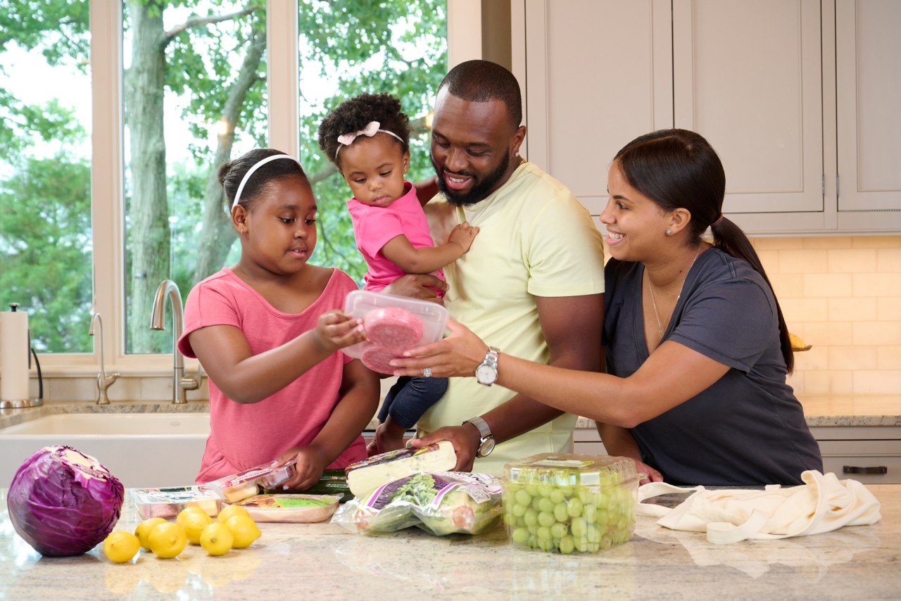 Family unpacking groceries
