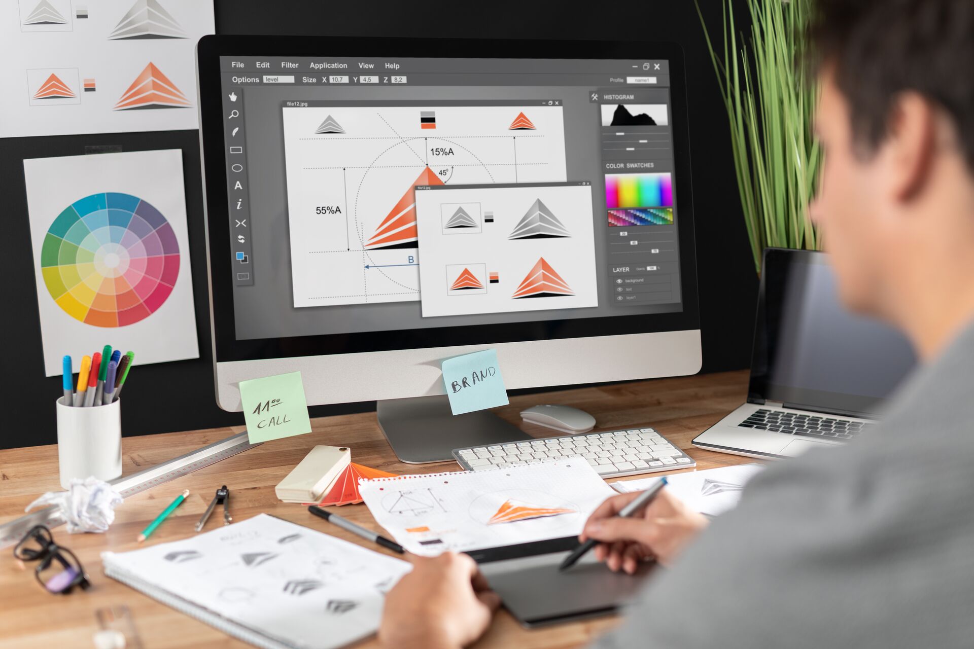 Graphic designer drawing sketches logo design