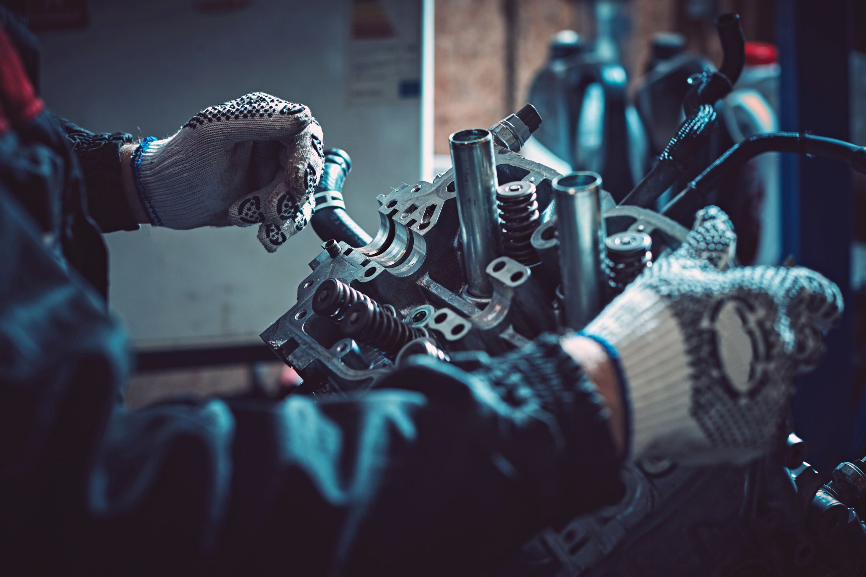 Closeup repair of an opposing engine by an auto mechanic