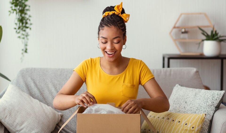 Woman consumer opening box
