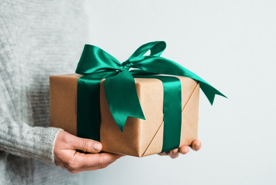 Female hands hold gift box, copy space right