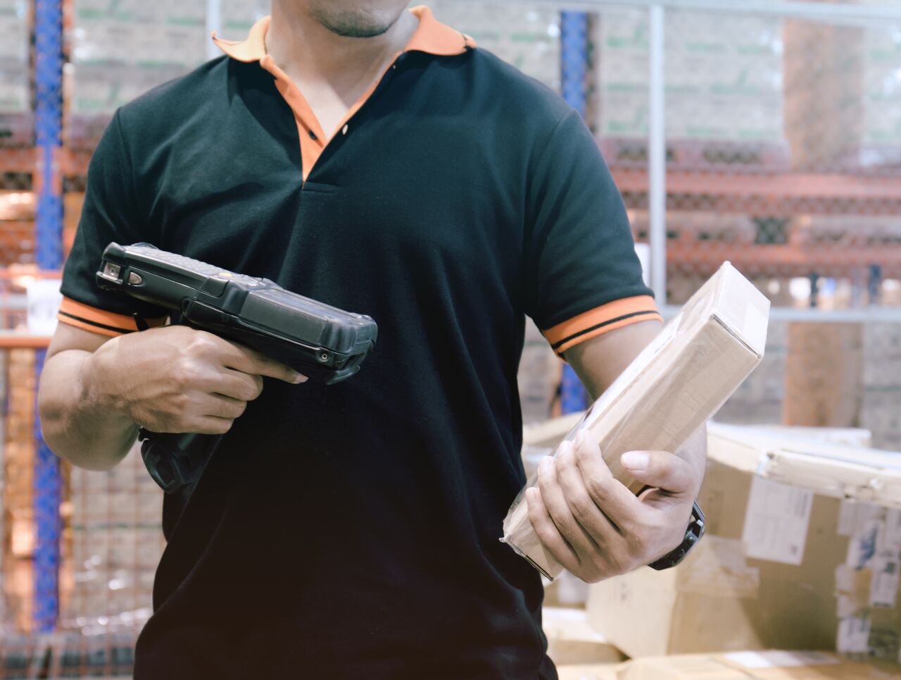 warehouse worker scanning a package