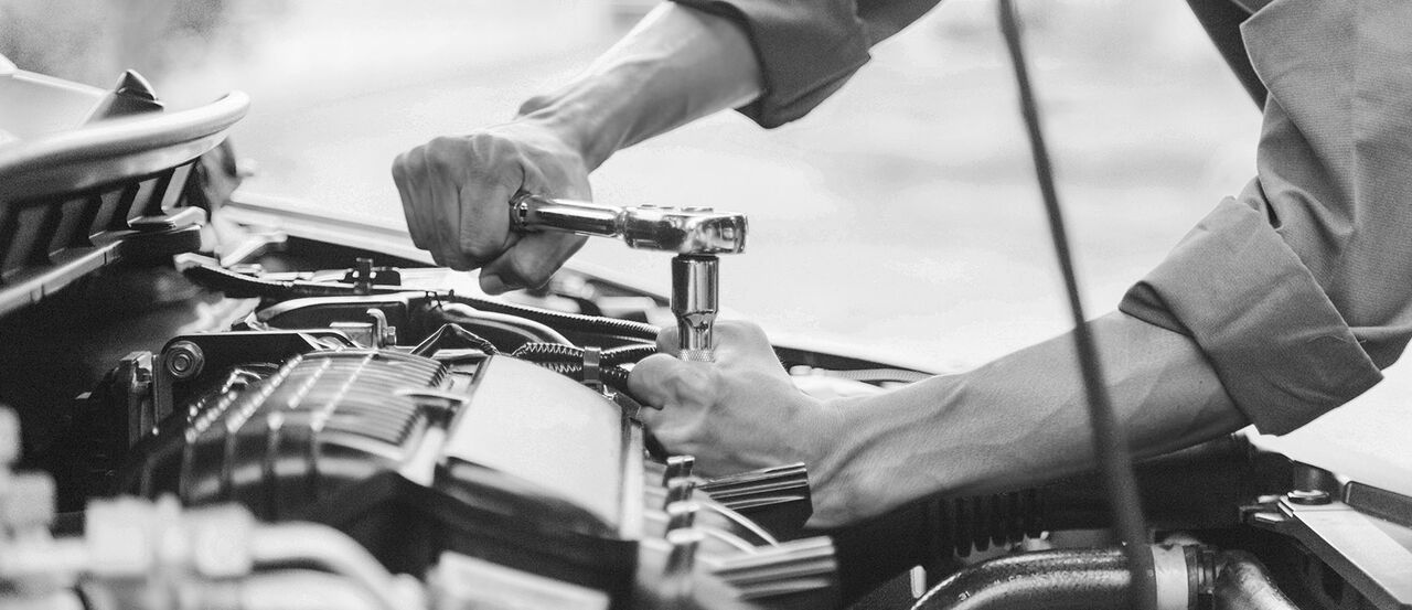 Automobile mechanic repairman hands repairing a car engine automotive workshop with a wrench, car service and maintenance,Repair service