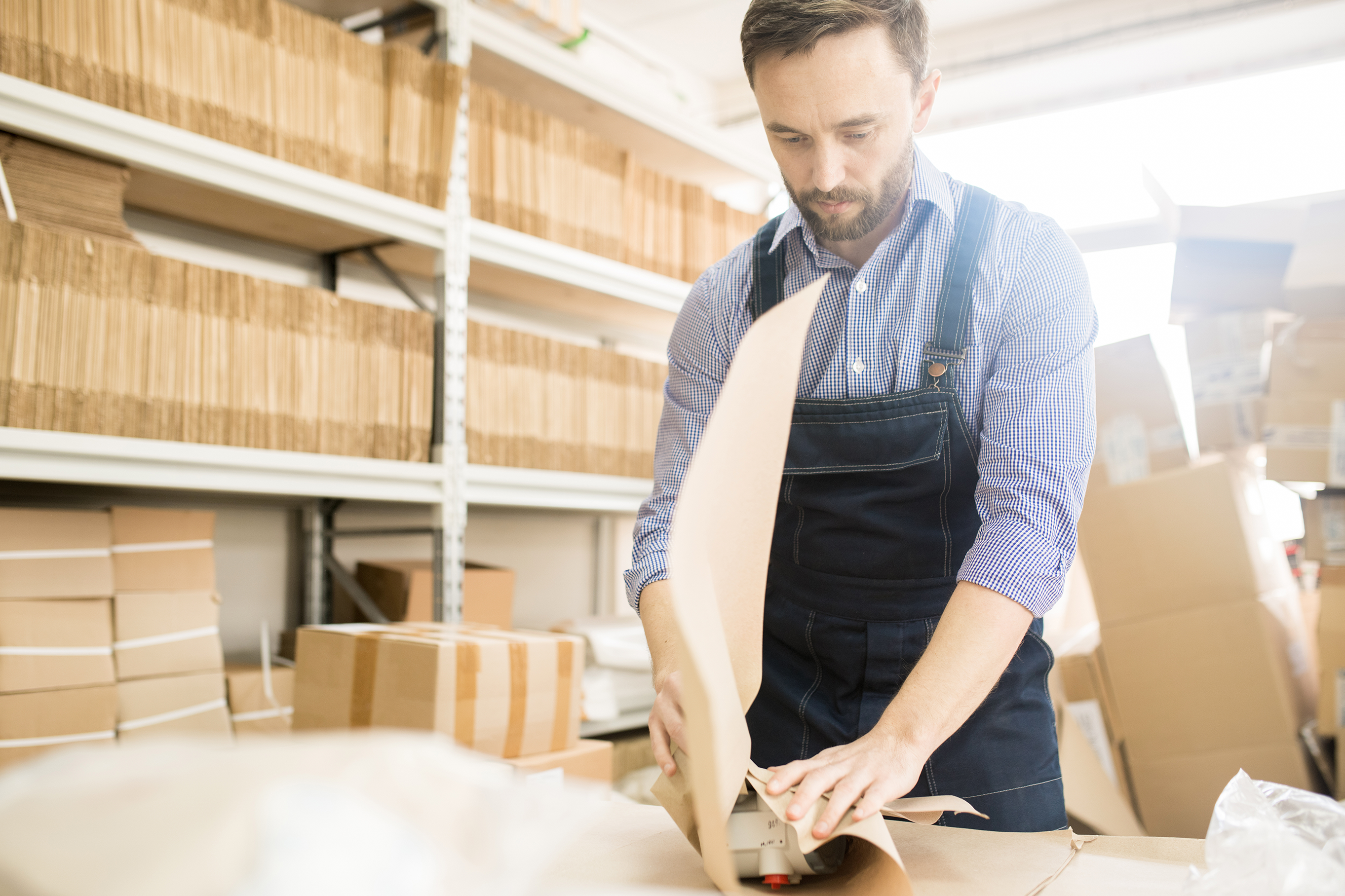 Warehouse Worker Packing Parcels for Shipment (small)
