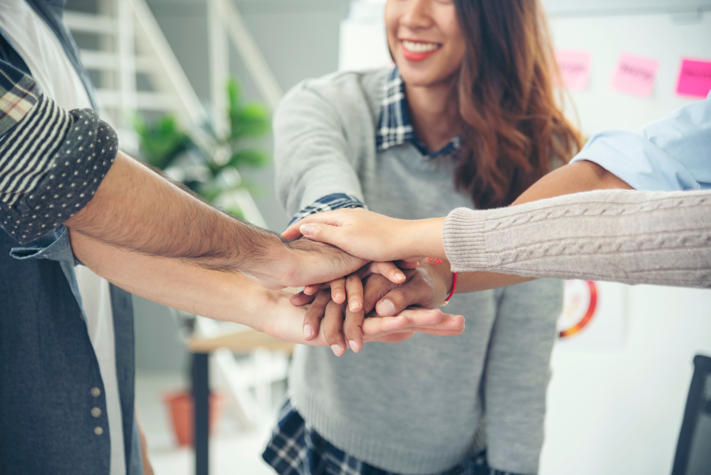 Group of People With Hands Together