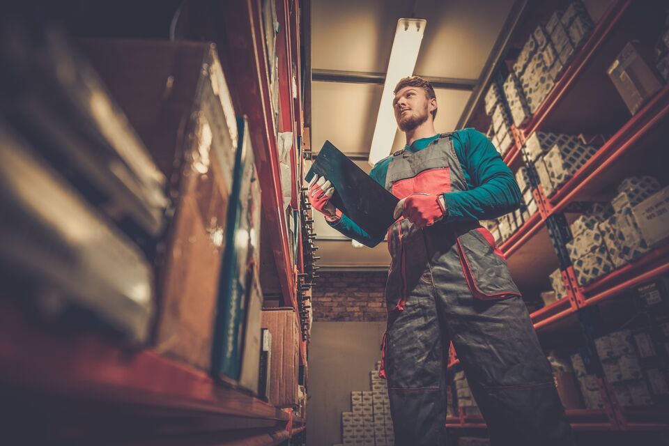 Worker on a automotive spare parts warehouse