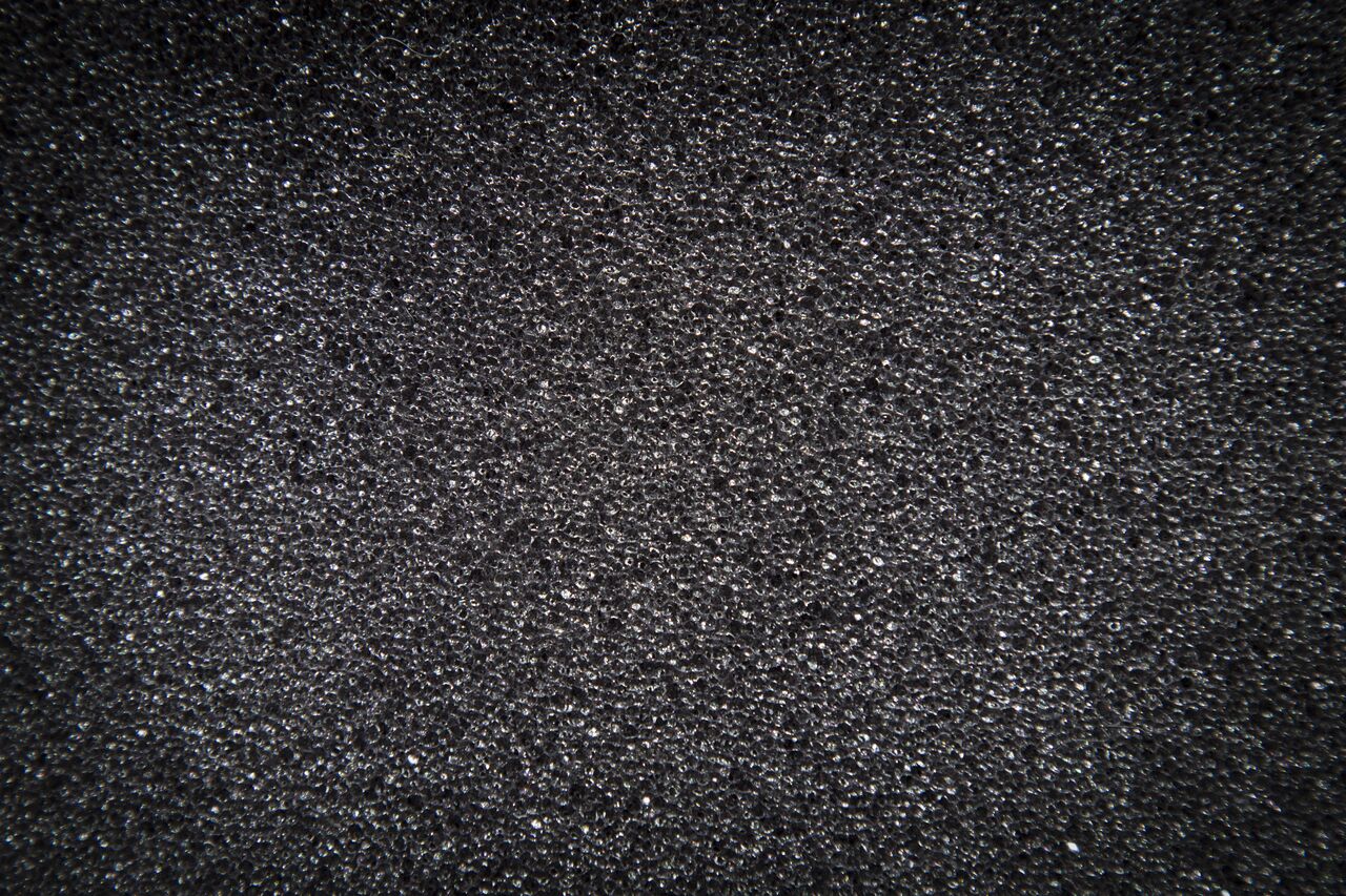 background texture of gray foam with a vignette