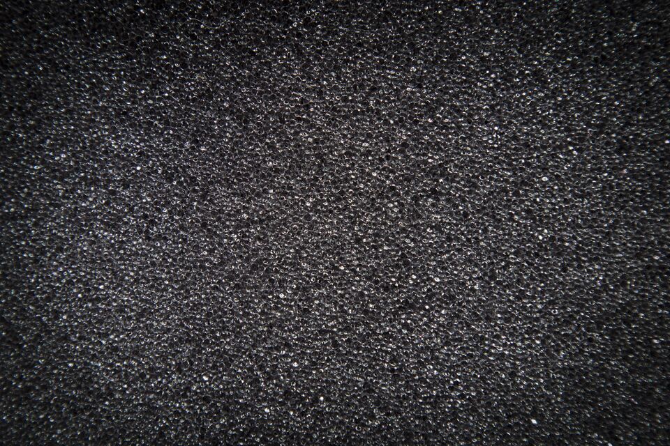 background texture of gray foam with a vignette