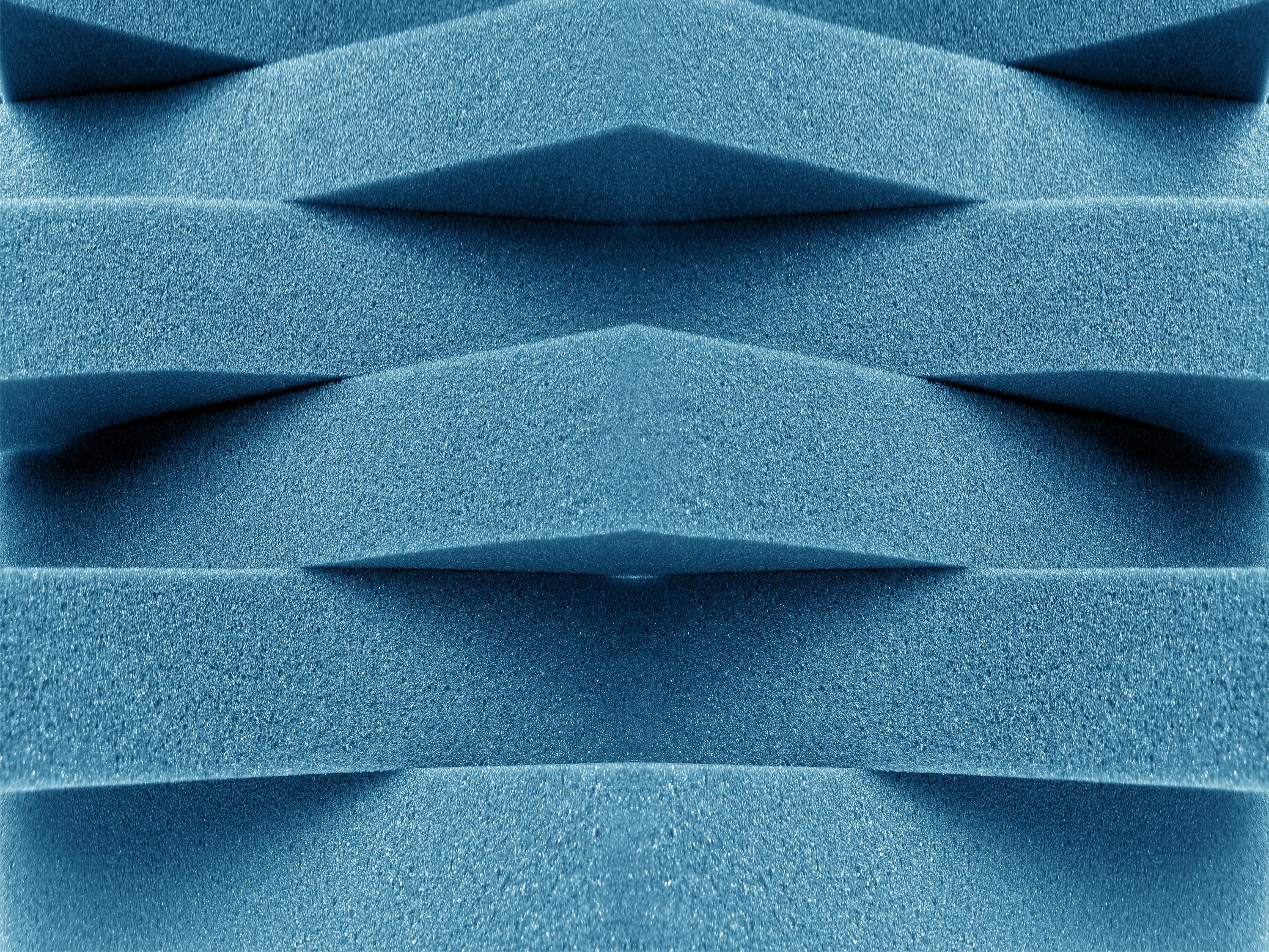 blue foam material arranged transversely. overlapping pile