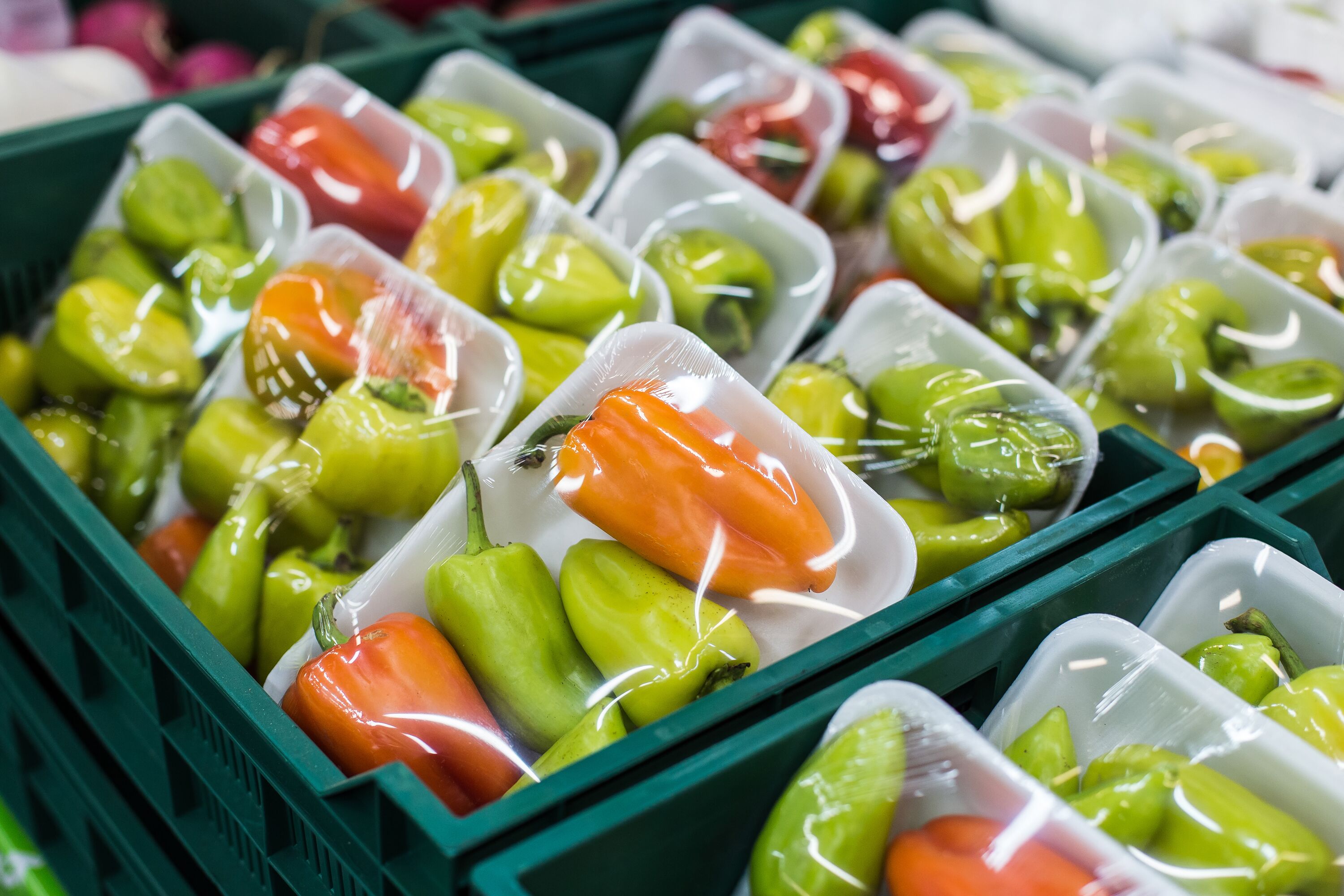Bulgarian pepper in a box on a shelf in a supermarket