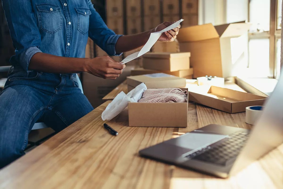Happy-female-customer-unpacks-internet-order